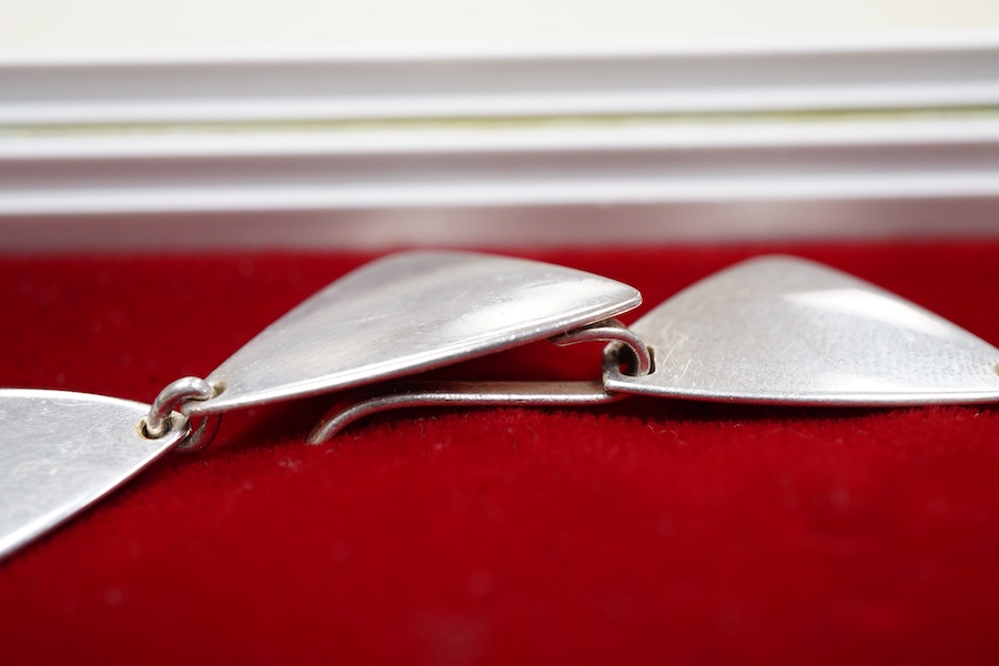 Hans Hansen, a modernist silver necklace, Denmark, composed of triangular linking in silver, to a concealed hook clasp, length 37.5cm, signed Hans Hansen, numbered 319, stamped Denmark, Swedish assay marks, gross weight